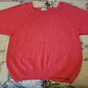 Pink short sleeved sweater.